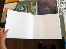 Load image into Gallery viewer, Athene Galiciadis – An Acrylic Brass Pyramid and Three Pendulums Attached to a Triangle on a Table