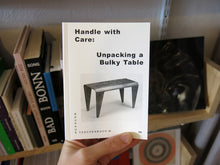 Load image into Gallery viewer, Handle With Care: Unpacking a Bulky Table